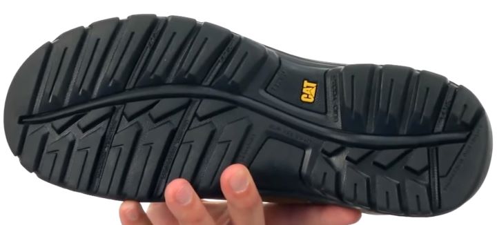 Checking the outsole of the work boots for delivery drivers