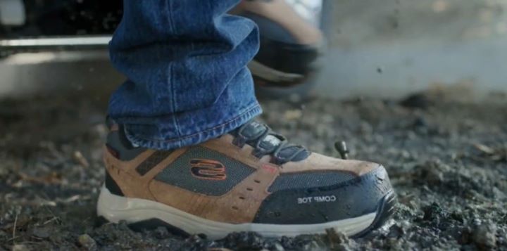 Stepping in on the ground using a Skechers work boot