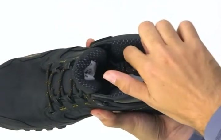 Reviewing the midsole of the work boot to ensure the protection and comfortability